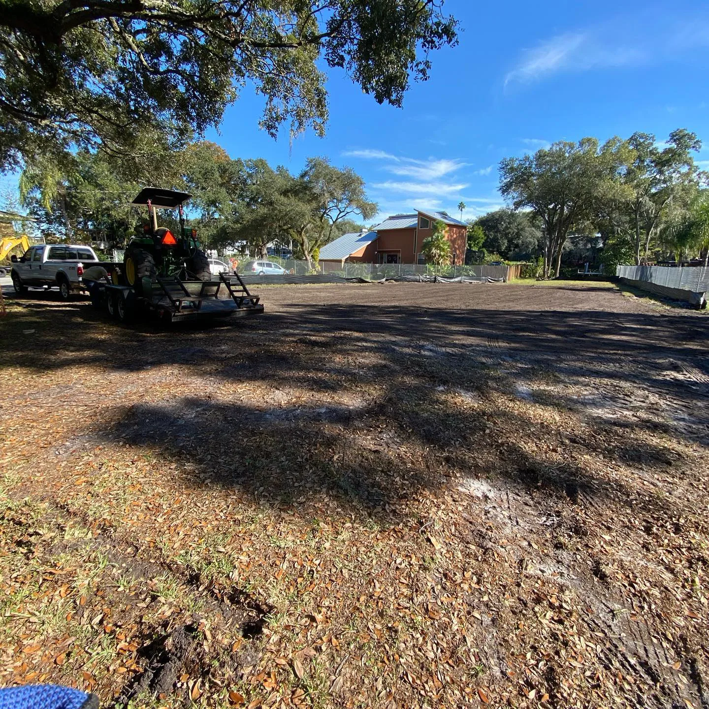Freshly cleared lot mulched down to dark bare soil